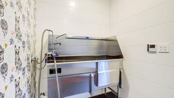 a kitchen with a stainless steel counter top and a shower